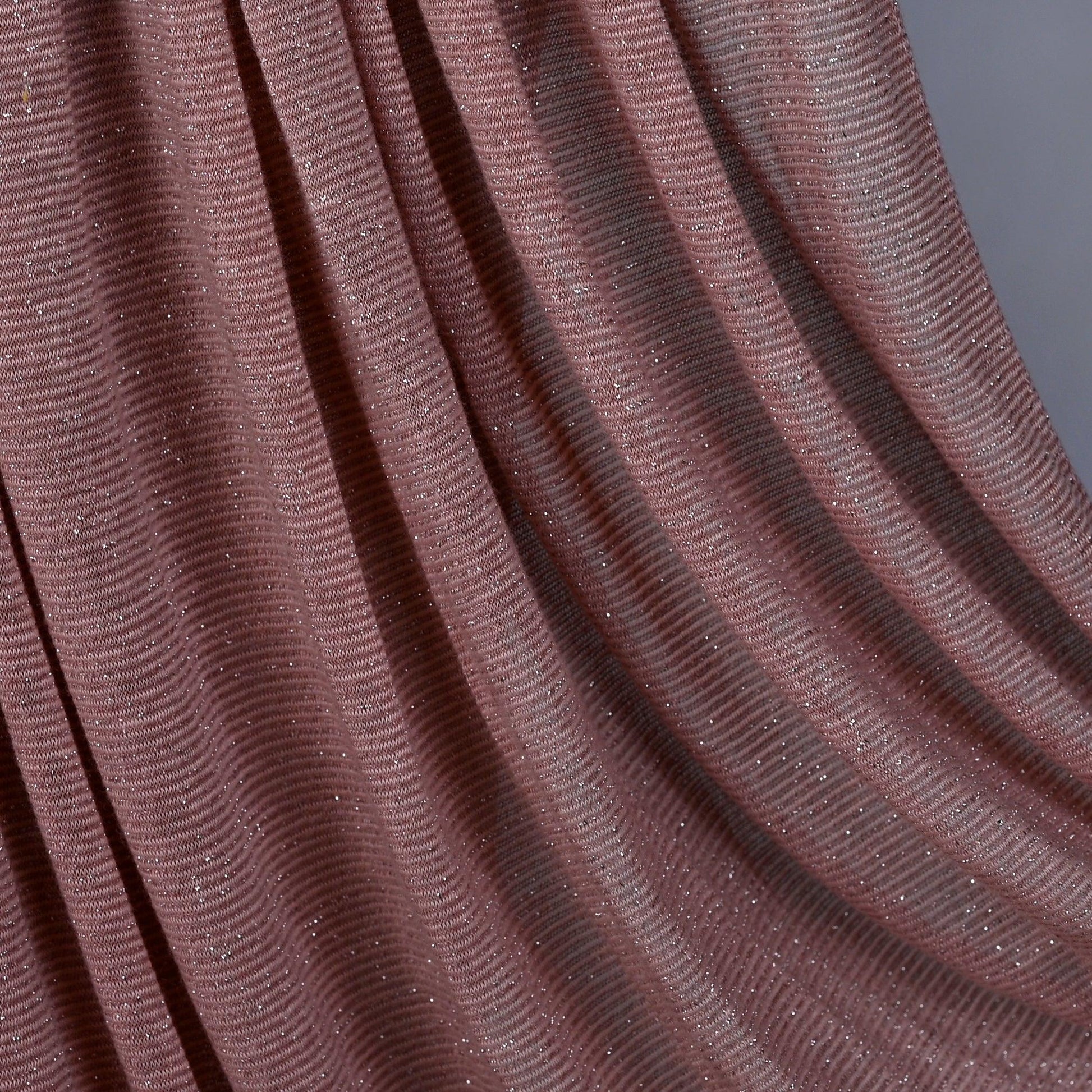 Side view of Hijabistic’s Klara Shawl in Quicksand Pink - luxurious yet comfortable fabric.