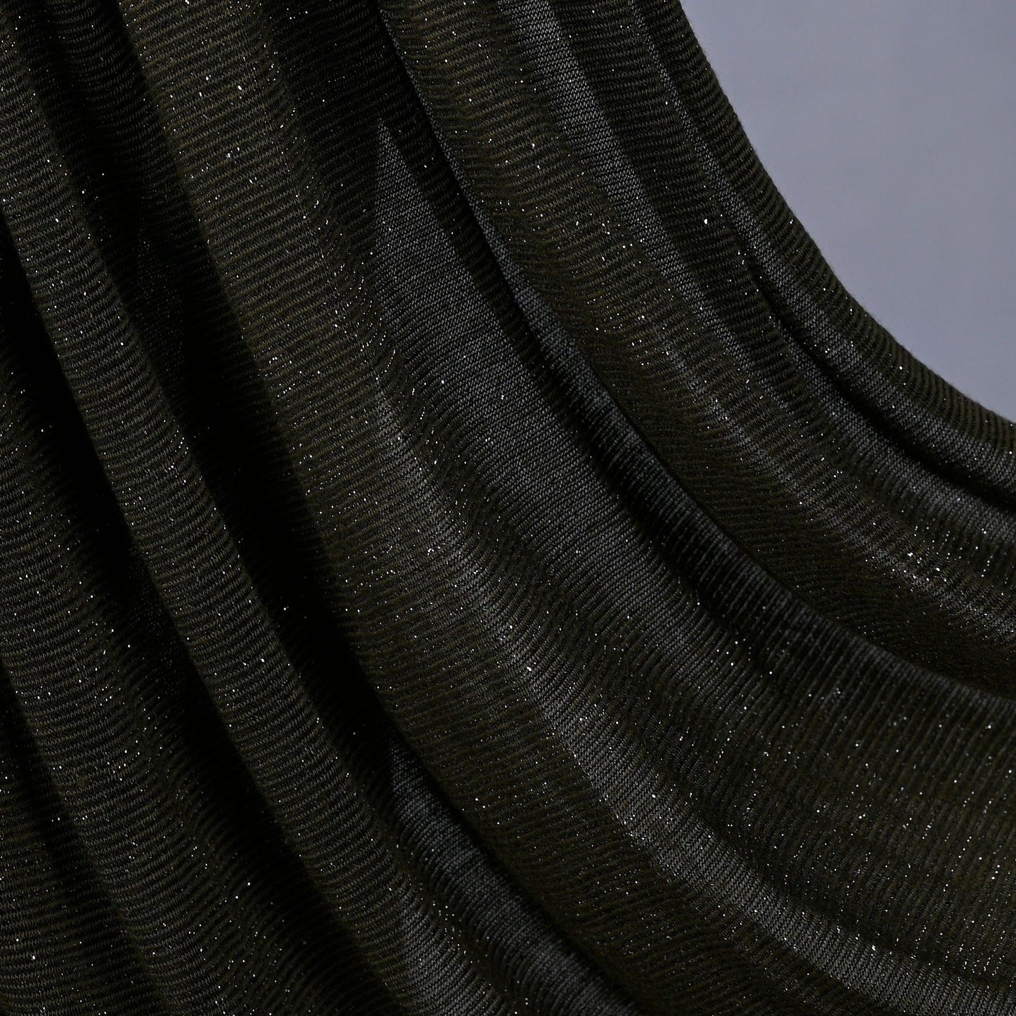 Close-up of Hijabistic’s Klara Shawl in Rangitoto Green - showing fine texture and subtle sheen.