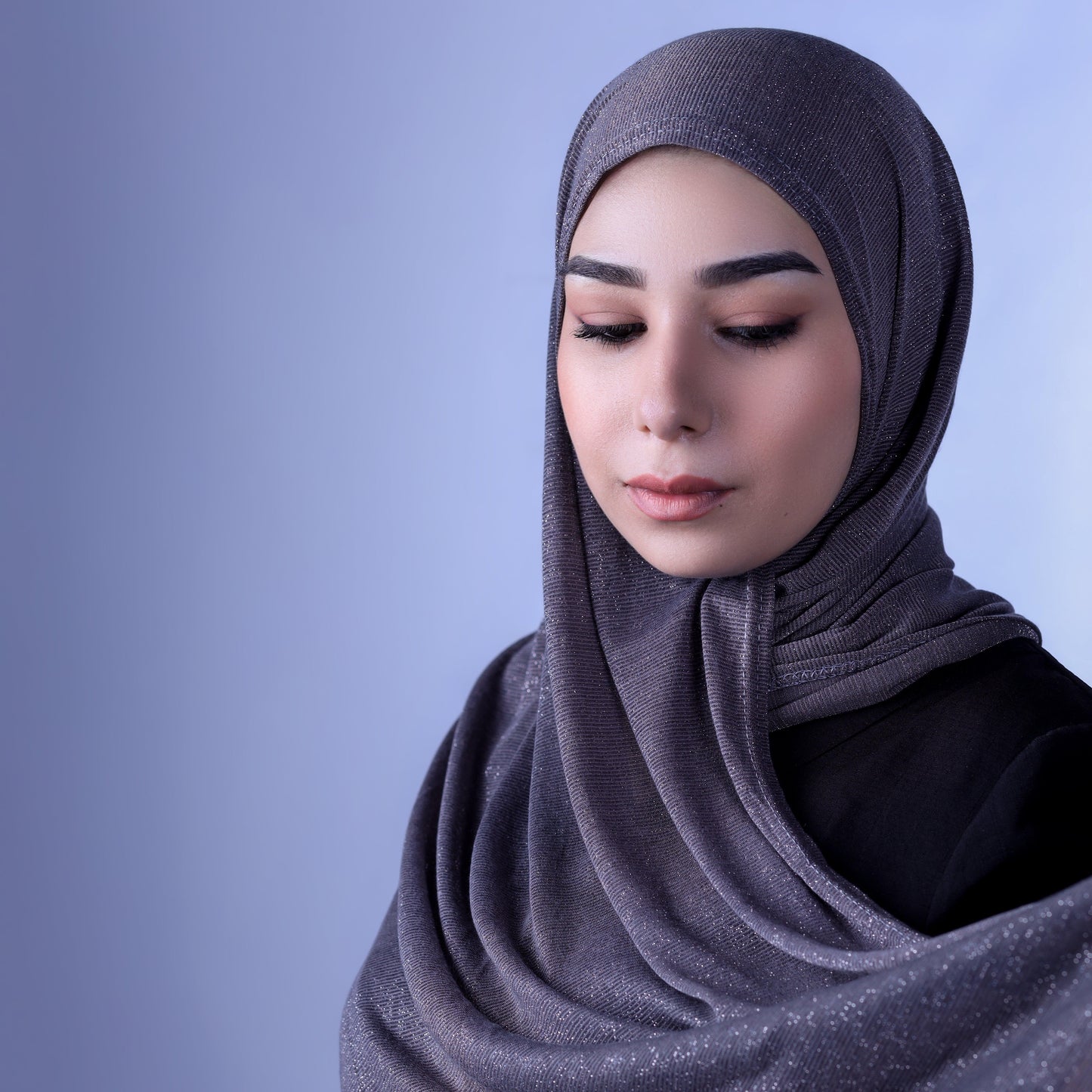 Front view of Hijabistic’s Klara Shawl in Shark Black - classic black Cotton Lycra Lamé hijab.